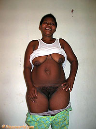 Luzita with pants down exposing an extremely full bush