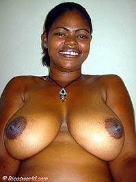 Ursela with big brown natural breasts smiling