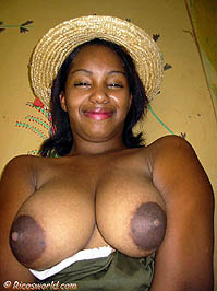 Violetta smiling with big natural breasts and wild look